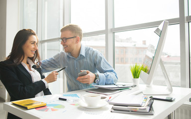 Businessman And Businesswoman Meeting In Modern Office