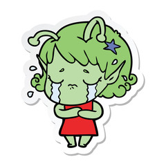 sticker of a cartoon crying alien girl
