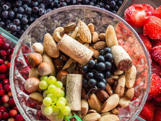 Ingredients for a healthy breakfast, nuts, berries, fruits, food for heart, rich with resveratrol, vitamin, antioxidants Top view