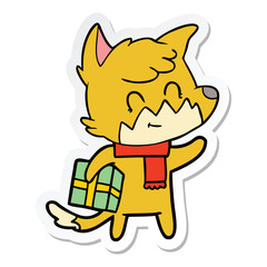 sticker of a cartoon happy fox with gift