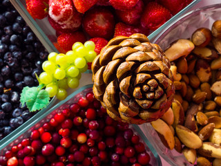 Ingredients for a healthy breakfast nuts, berries, fruits, food for heart, rich with resveratrol, vitamin, antioxidants Top view