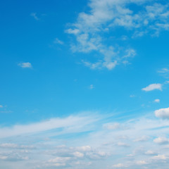 Naklejka na ściany i meble White clouds on beautiful blue sky.