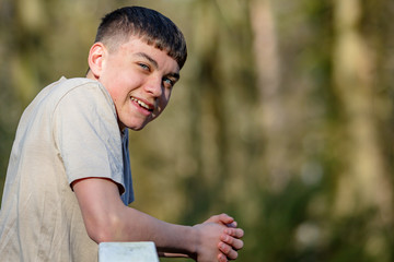 Fototapeta premium Teenage boy outside on a bright Spring day