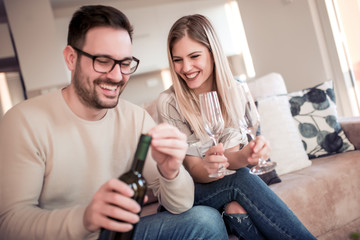 Couple drink wine at home