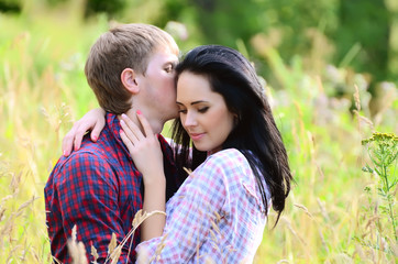 Fototapeta premium Enamoured young pair on the nature