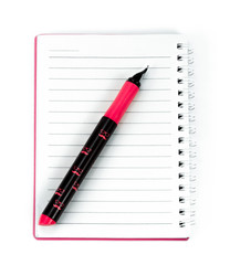 White lined spiral notebook with pen on a white background. Diagonal composition. Horizon photo