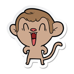 sticker of a cartoon laughing monkey