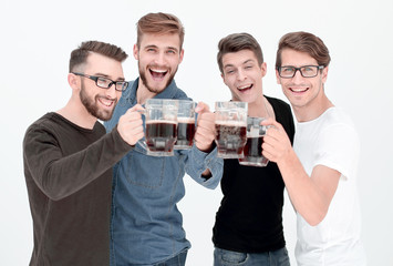 four happy young men, clinking glasses of bee