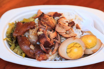 Khao Kha Moo (Khao Kha Mu), Traditional Thai braised pig's trotter slow simmered in soy sauce and...