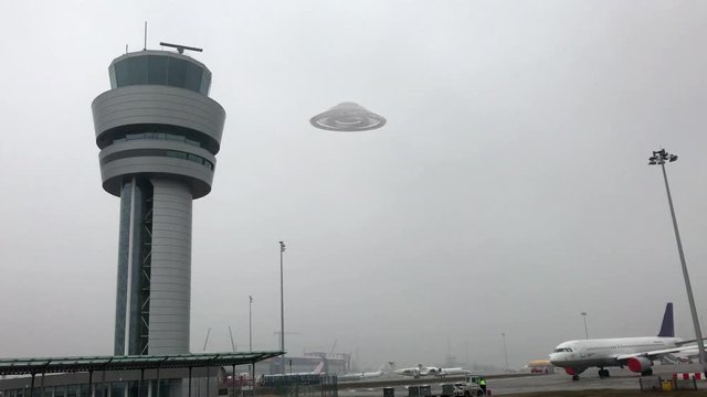 flying saucer hovering close to airport tower and fly up Video Compisting simulates Real footage with visual effects elements of ufo alien spacecraft hovering close to airport tower and fly up