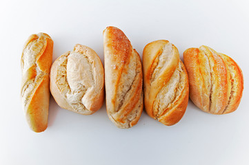 Five different small breads on the white background