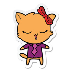 sticker of a cartoon cat with bow on head