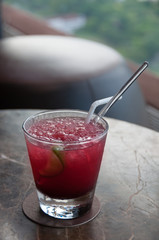 Cocktail with cranberry juice, ice and lime