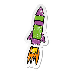 distressed sticker cartoon doodle of a space rocket