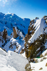 Winter in french mountains. French Alps covered with snow. Panoramatic view of Mont Blanc in the middle of the photograph. Highest european mountain, France.