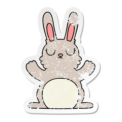 distressed sticker of a quirky hand drawn cartoon rabbit