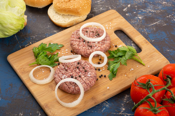 Raw minced beef burgers