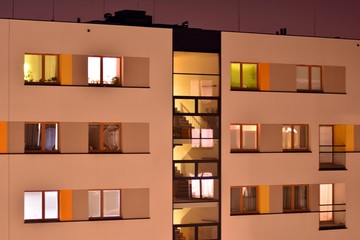Fototapeta premium Exterior of apartment building at night 