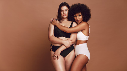 Different size females in lingerie proud of their body