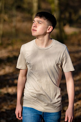 Teenage boy outside on a bright Spring day