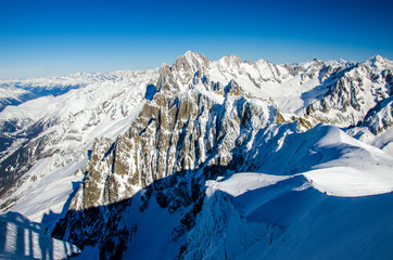 Beatiful mountain panorama in french Alps. Chamonix Mont Blanc during winter time. Best place for winter holiday, skiing and snowboarding.