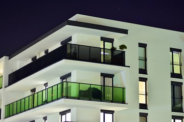 Exterior of apartment building at night 