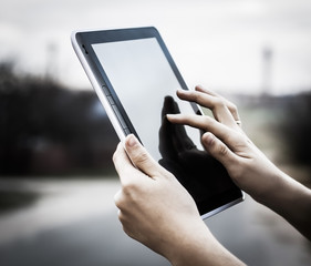 people and technology .closeup of person holding digital tablet
