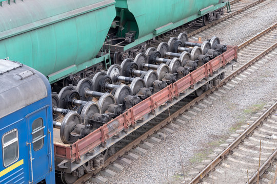 The car with new railway wheels for locomotives or train cars.
