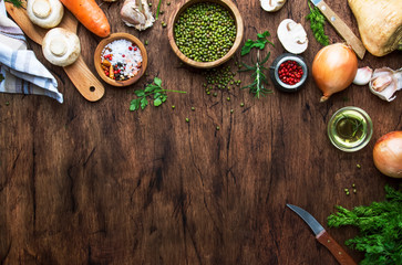 Fototapeta na wymiar Ingredients for cooking green lentils with mushrooms and vegetables, spices and herbs, vintage wooden kitchen table, food cooking background, place for text. 