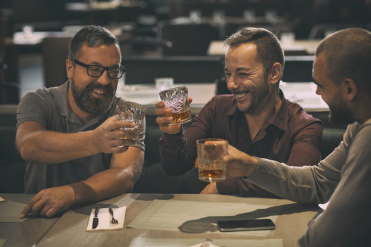 Image result for high-quality images of a man drinking Whisky with friends.
article on whiskey-drinking games with friends