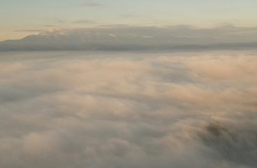 Fototapeta na wymiar Foggy landscape in mountains