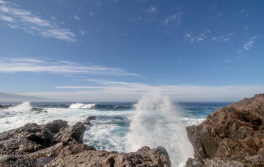 great crashing waves over the rocks