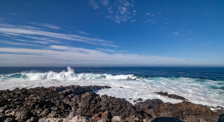 big waves rolls over the rocks