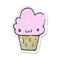 distressed sticker of a cartoon cupcake with face