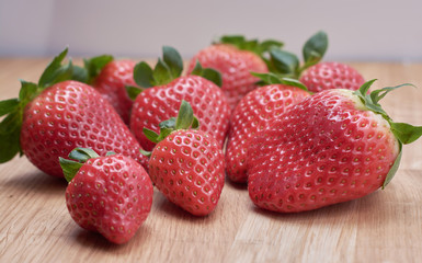 close up fresh strawberries with natural wood background