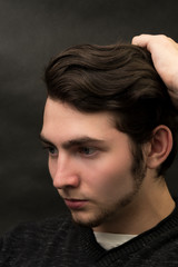 Obraz premium young man close up portrait, on black background