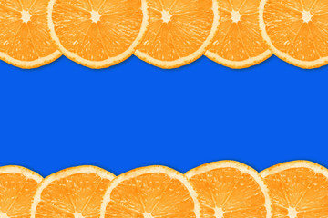 Orange fruit slices design pattern. Blue empty copy space horizontal stripe vitamin diet background.