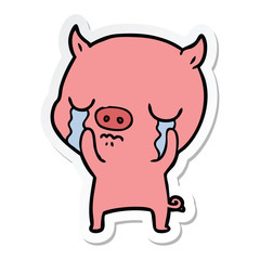 Obraz premium sticker of a cartoon pig crying