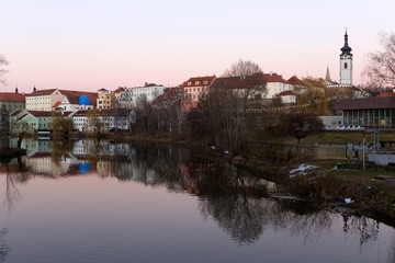 Fototapeta premium Evening winter royal medieval Town Pisek with the Castle above the river Otava, Czech Republic 
