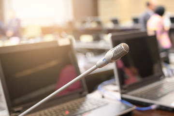 Microphone over the blurred business forum Meeting or Conference Training Learning Coaching Room Concept, Blurred background.