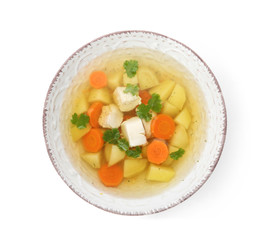 Dish with fresh homemade chicken soup on white background, top view