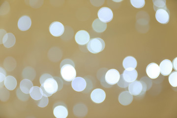 Blurred view of shiny silver lights. Bokeh effect