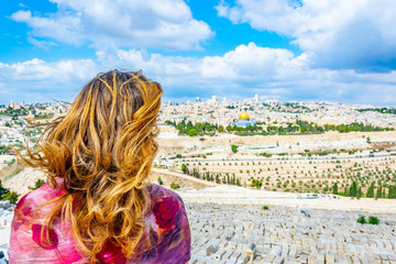 Woman is looking at Jerusalem from the mount of olives, Israel