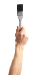 Man holding paintbrush on white background. Construction tools
