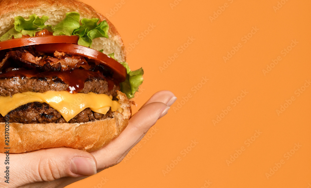 Wall mural close up big cheeseburger barbeque sandwich with marble beef on yellow