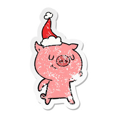 happy distressed sticker cartoon of a pig wearing santa hat