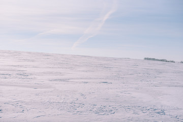 Snow-covered field. The general plan in the winter. Background field in winter.