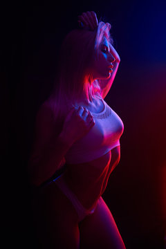 Pole dance girl with perfect body in black sexy lingerie. Night club concept
