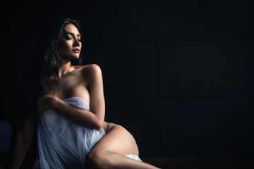 emotion of art work concept lady sexy body slim posing thai model on dark background - obrazy, fototapety, plakaty