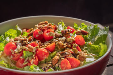 Summer salad with tomatoes, seeds and raisins